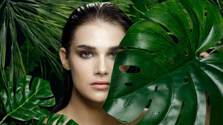Woman's face with leaves: natural beauty, skin rejuvenation