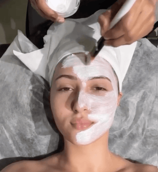 Woman receiving facial treatment at Leor clinic