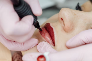 Woman receiving lip treatment