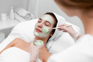 Woman receiving facial mask treatment at Leor Clinic