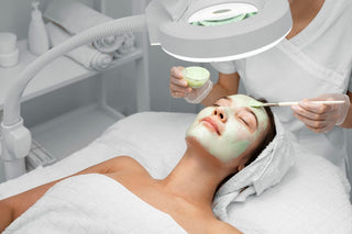 Woman receiving face mask treatment at Leor Clinic