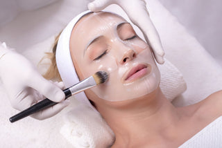 Woman receiving face mask treatment at Leor Clinic