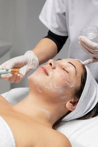 Woman receiving facial treatment at Leor Clinic