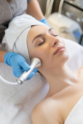Young woman receiving face skin treatment at Leor Clinic